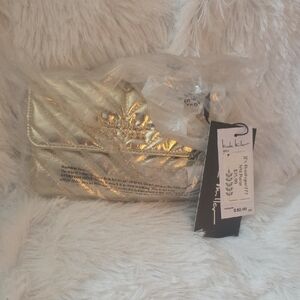 Nicole Miller Gold Clutch with Modern Design